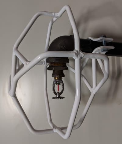 Side-mounted heavy-duty sprinkler head guard