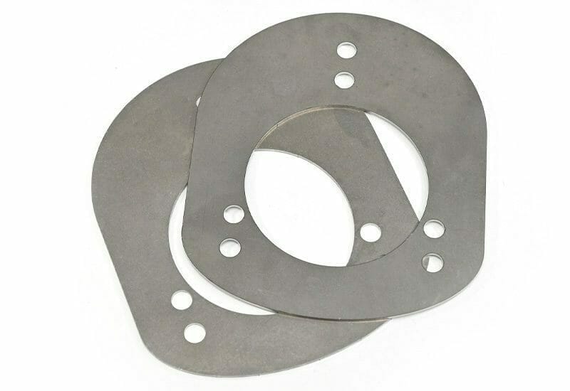 Image of two laser cut cold rolled carbon steel brackets on a white background